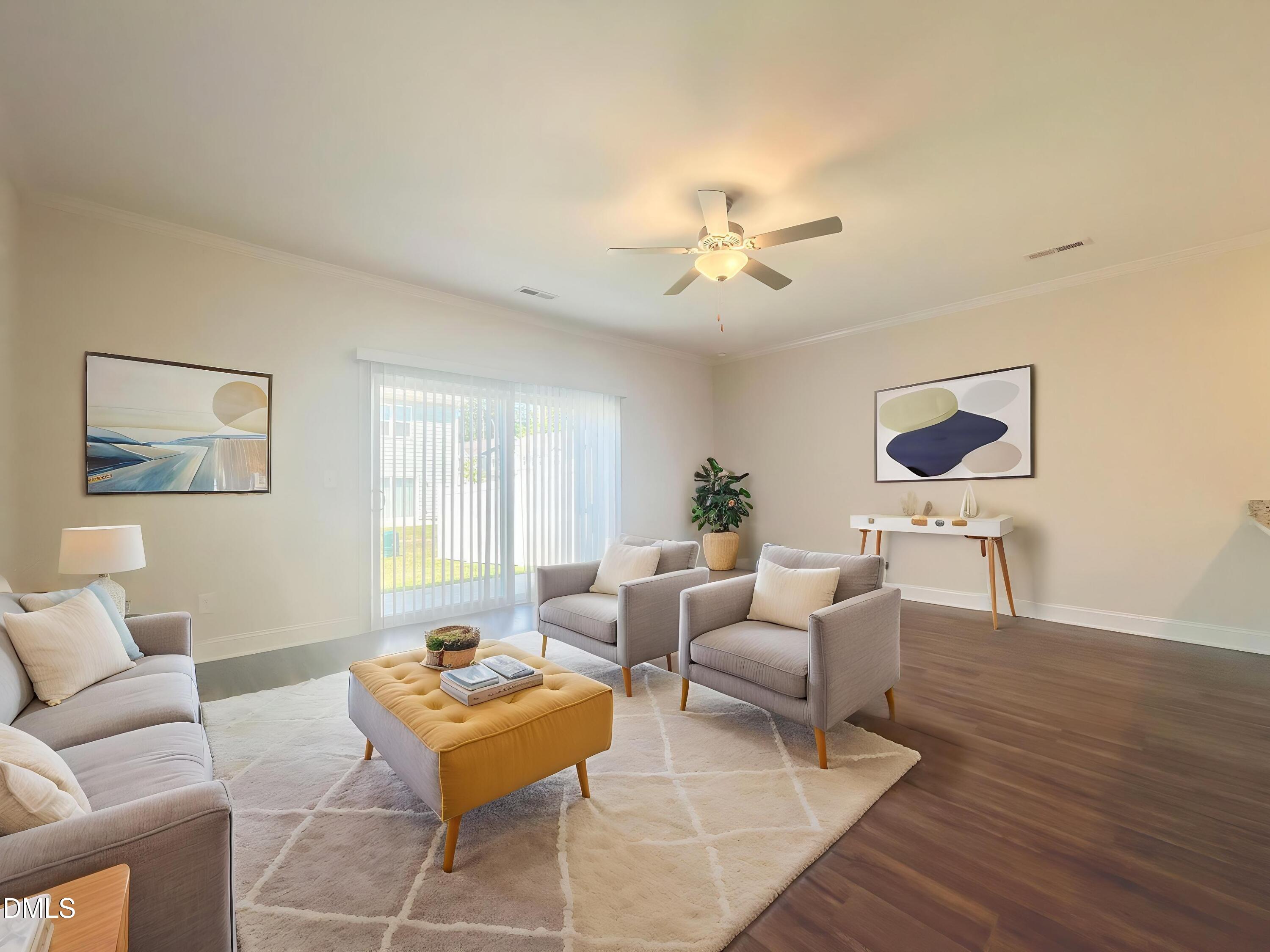 6945 Outfall Point Lane Raleigh, NC 27616 - Photo 5 of 23 a living room with furniture a wooden floor and a window
