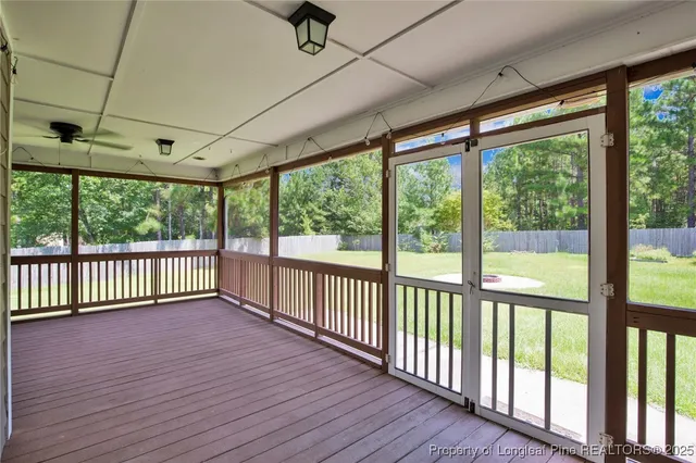 a view of a porch with wooden floor