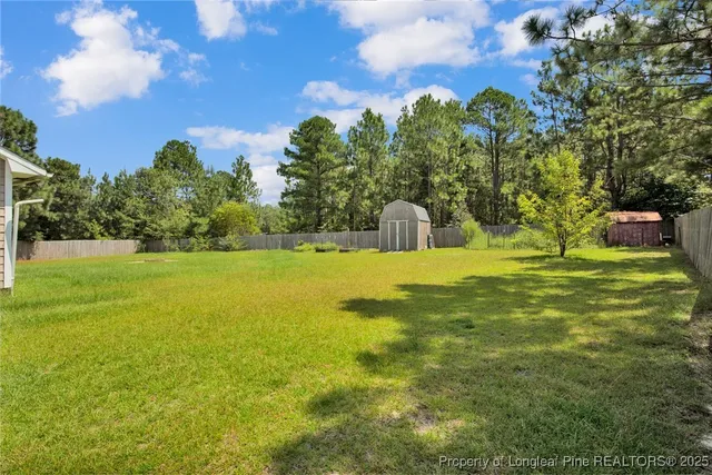 a view of a swimming pool with a yard