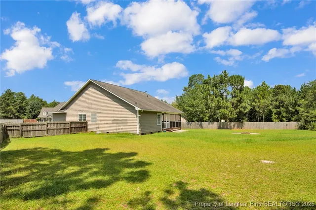 a view of a house with a big yard