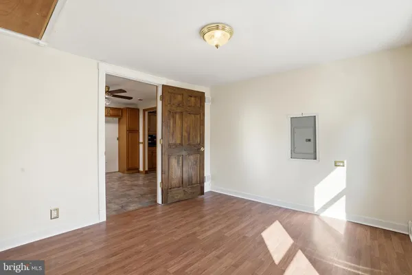 a view of hallway with wooden floor