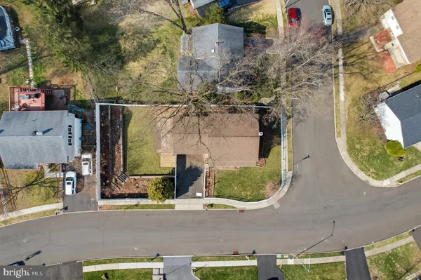 an aerial view of a house with outdoor space