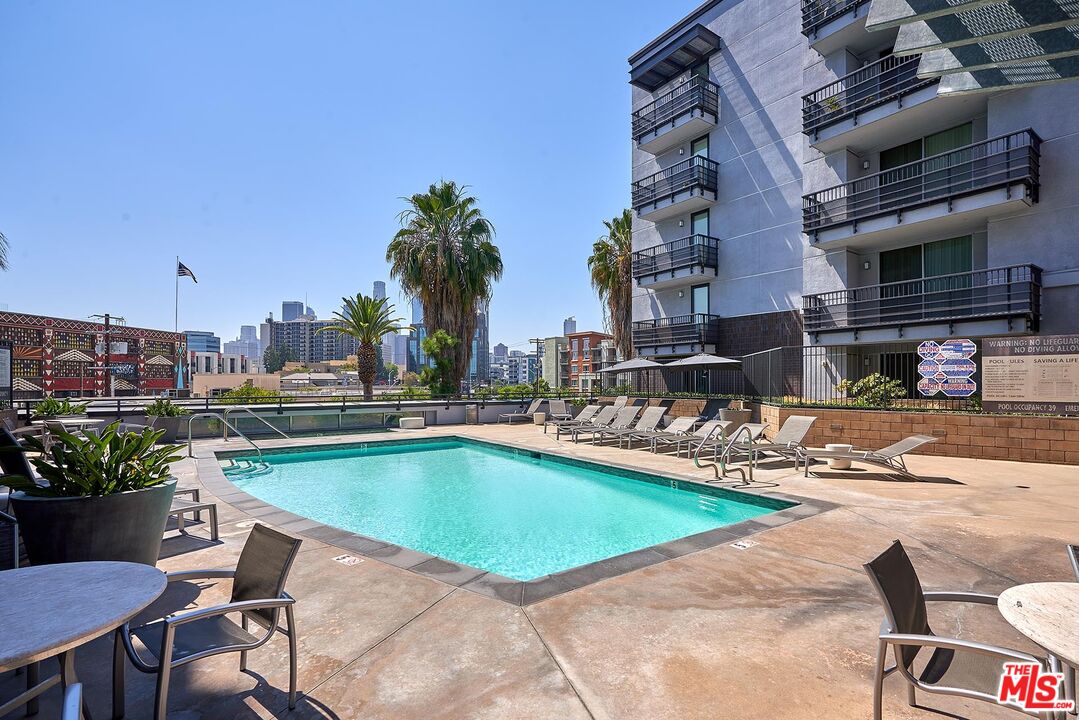 629 Traction Avenue, Unit 239 Los Angeles, CA 90013 - Photo 31 of 44 a view of a swimming pool with outdoor seating