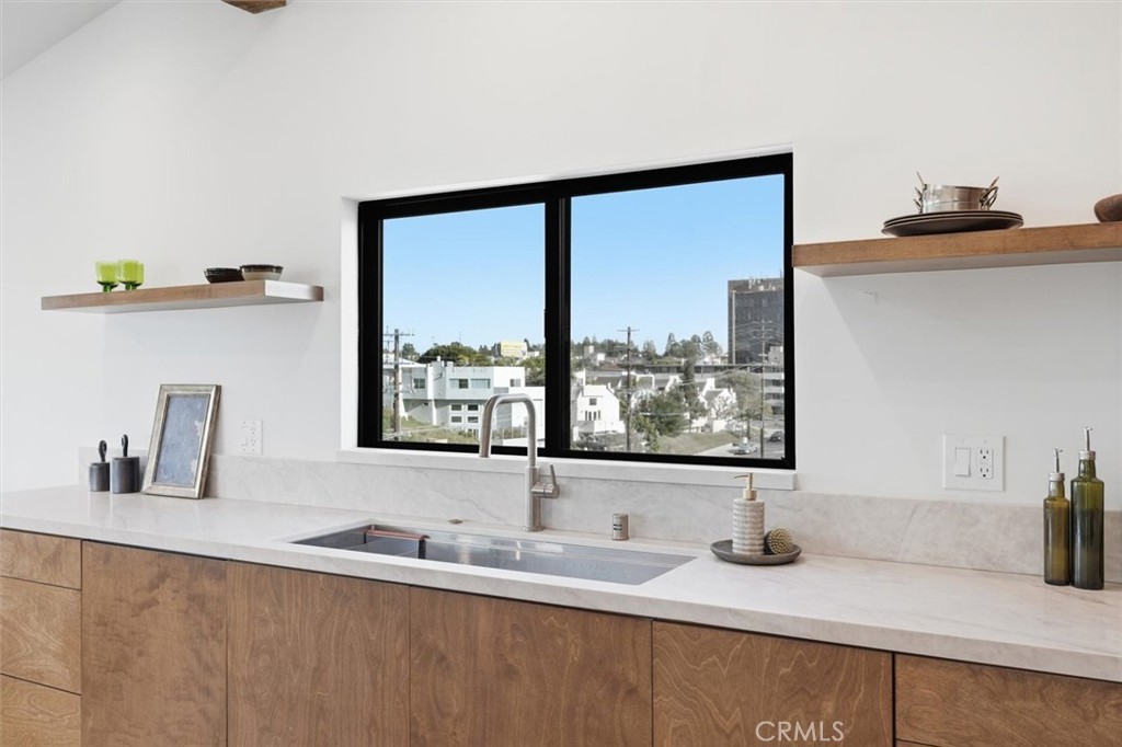 8140 Calabar Avenue Playa del Rey, CA 90293 - Photo 17 of 60 a bathroom with a granite countertop sink and a window