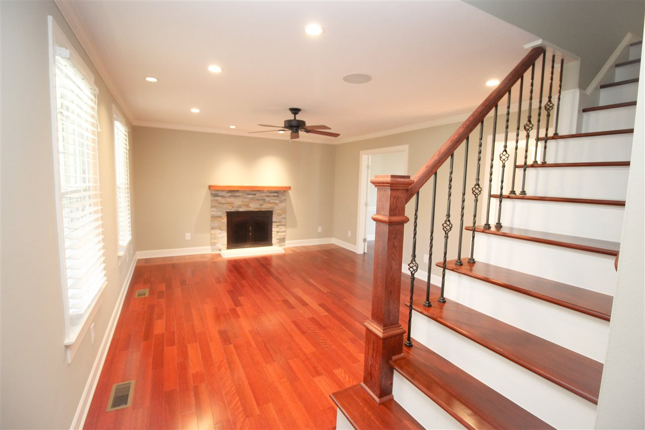 Welcome! A grand staircase greets you and opens up to the living room! Entry