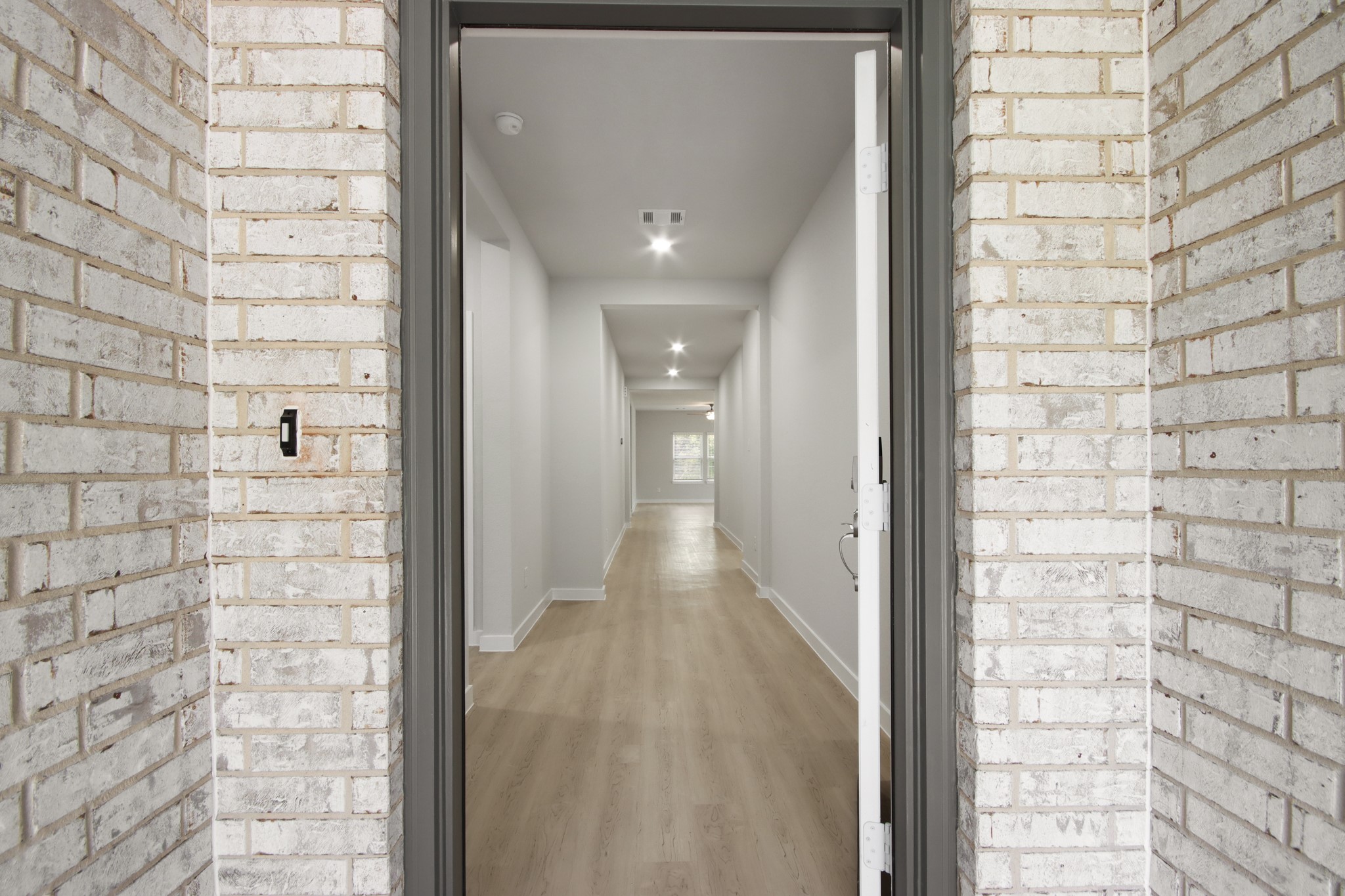129 Byu Bnd Boulevard Angleton, TX 77515 - Photo 2 of 25 a view of a hallway with brick walls
