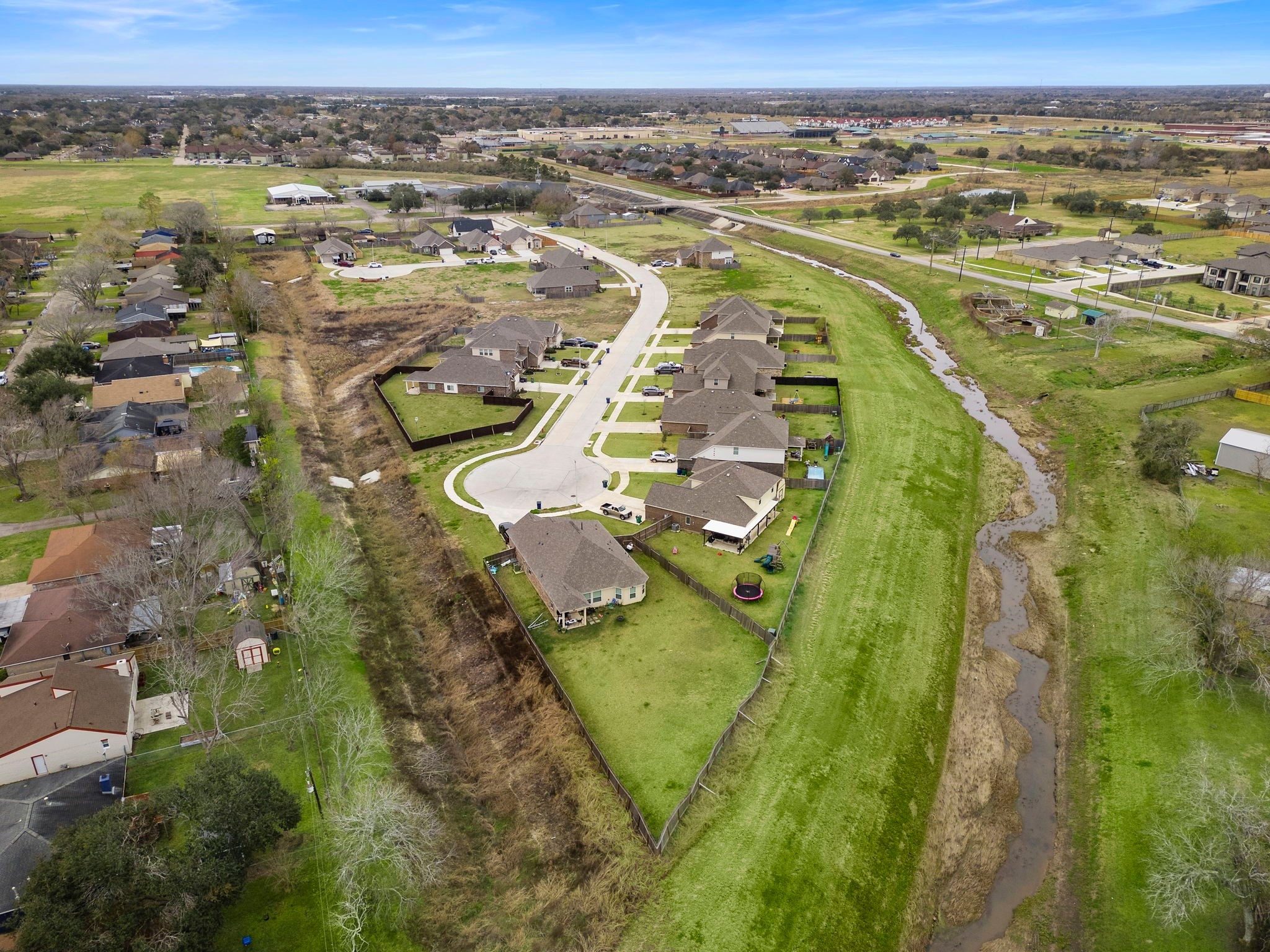 129 Byu Bnd Boulevard Angleton, TX 77515 - Photo 23 of 25 an aerial view of residential houses with outdoor space