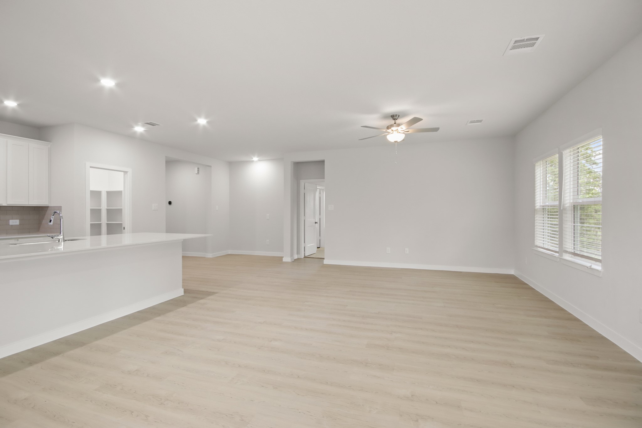 129 Byu Bnd Boulevard Angleton, TX 77515 - Photo 6 of 25 a view of an empty room with a kitchen