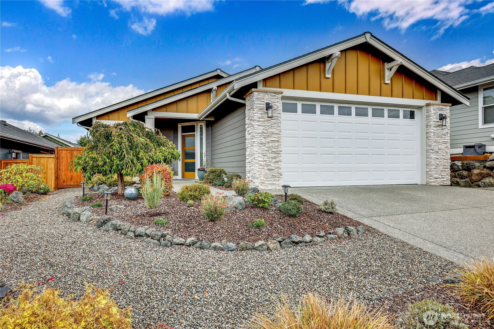 90 Village Green Sequim, WA 98382 - Photo 1 of 40 a front view of house with garage and yard