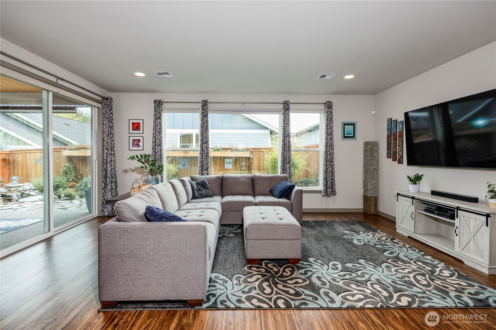 90 Village Green Sequim, WA 98382 - Photo 17 of 40 a living room with furniture and a flat screen tv