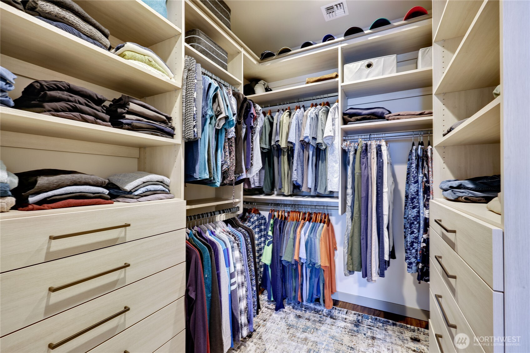 90 Village Green Sequim, WA 98382 - Photo 21 of 40 a view of walk in closet with clothes and shoes