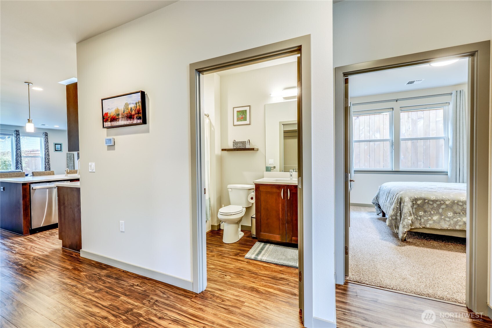 90 Village Green Sequim, WA 98382 - Photo 6 of 40 a en suite bathroom with a granite countertop sink and a mirror