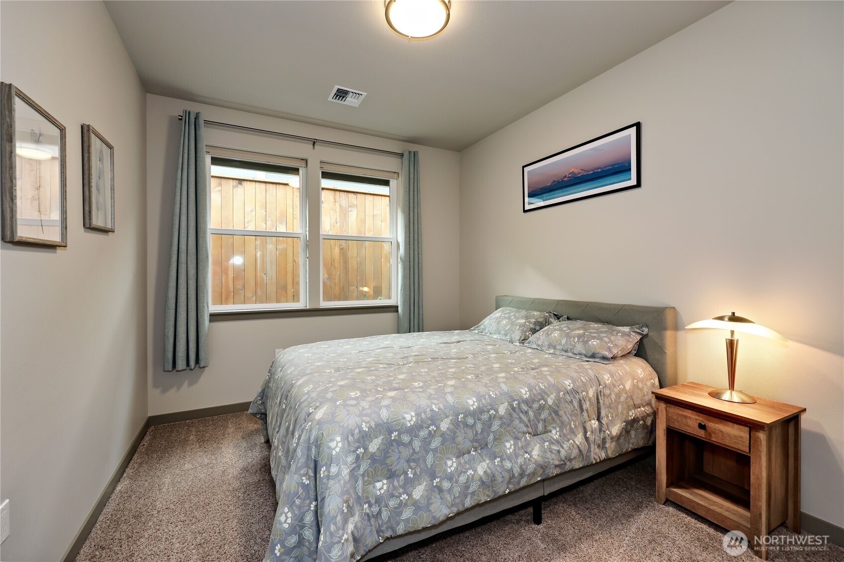 90 Village Green Sequim, WA 98382 - Photo 8 of 40 a bedroom with a bed and a window