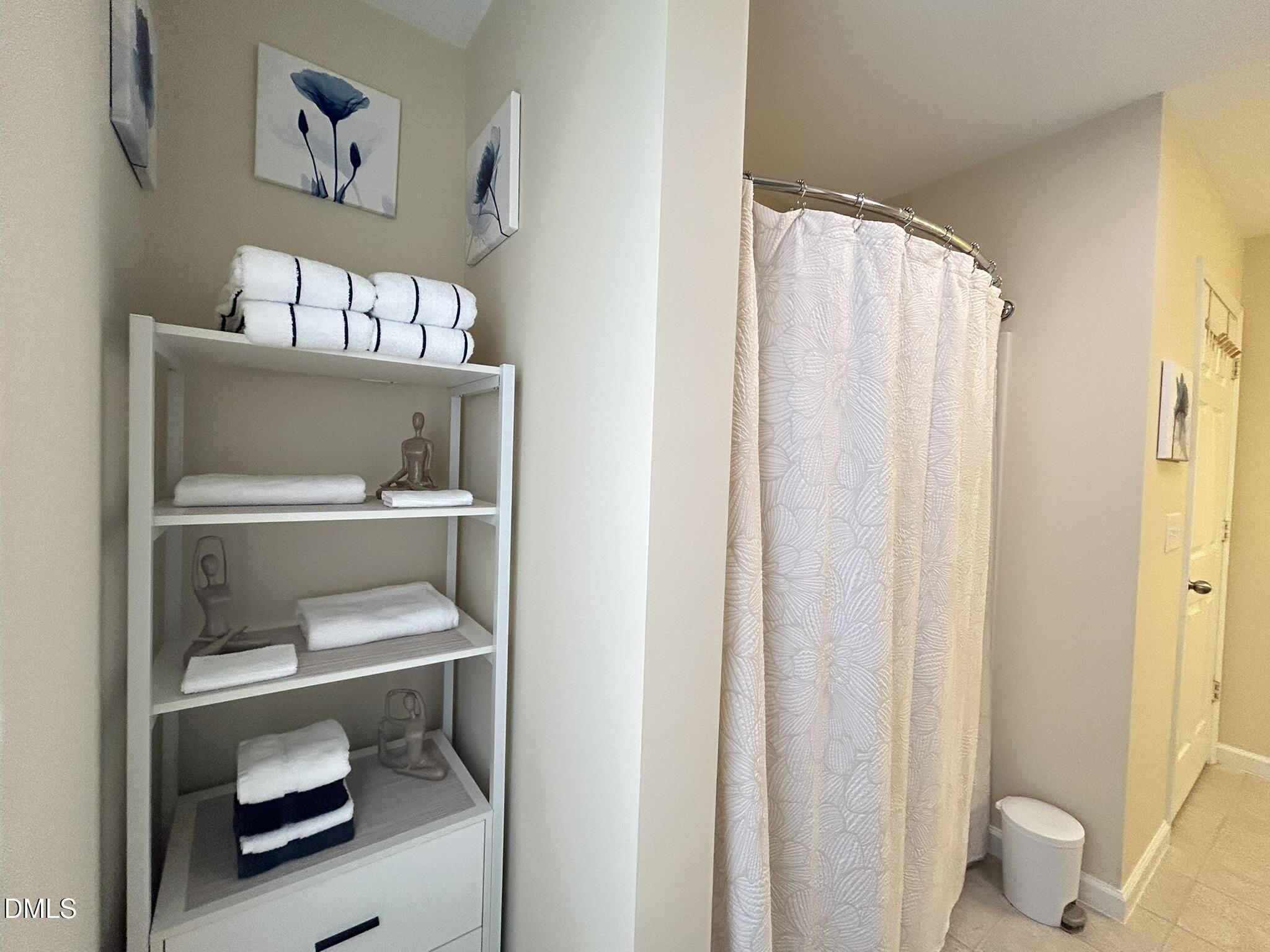 2510 Friedland Place, Unit 102 Raleigh, NC 27617 - Photo 32 of 42 a room with a book shelf and a window