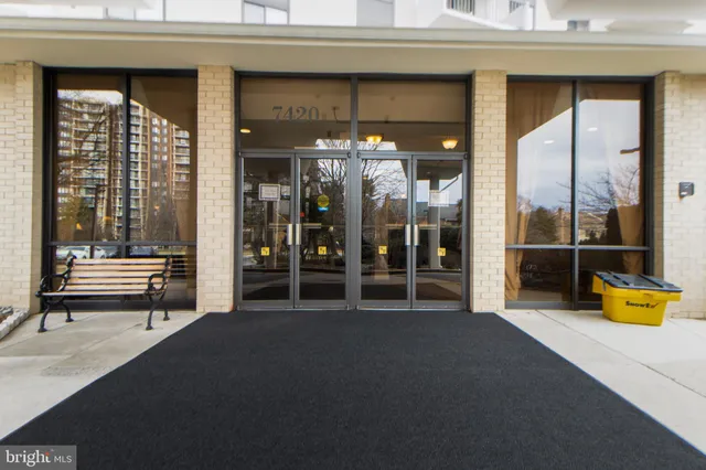a lobby with furniture and window