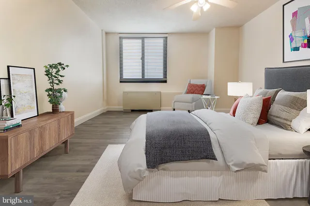 a bedroom with a large bed and a couch