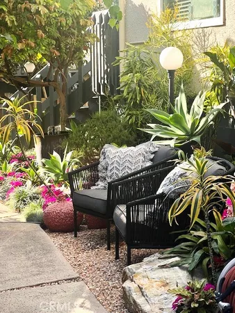 a view of a backyard with sitting area and furniture