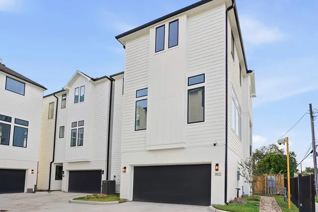 a front view of a house with garage