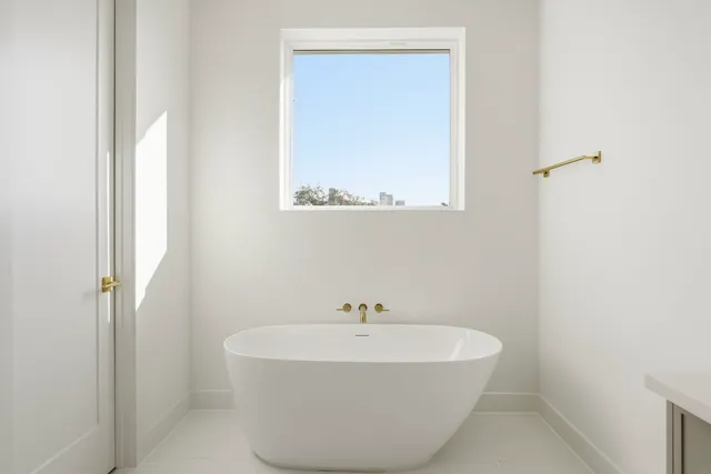 a white bath tub sitting in a bathroom