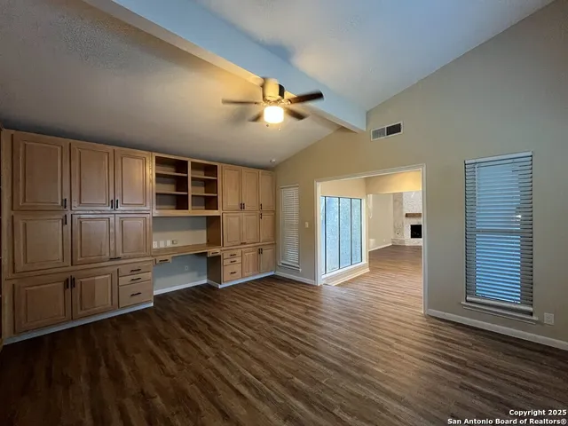 a kitchen with a stove a refrigerator and a sink