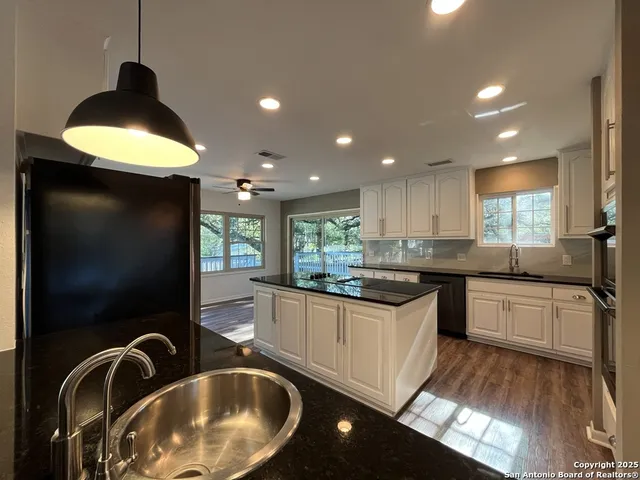 a bathroom with a toilet a sink and a mirror