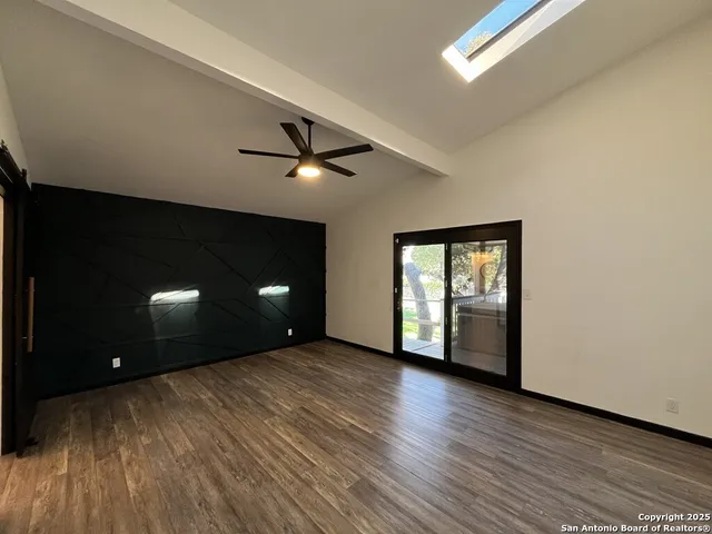 a bathroom with a sink mirror toilet and shower