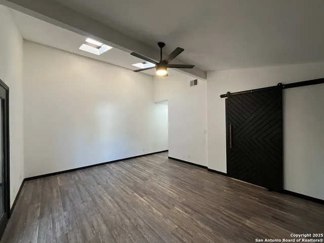 a view of a room with wooden floor and balcony