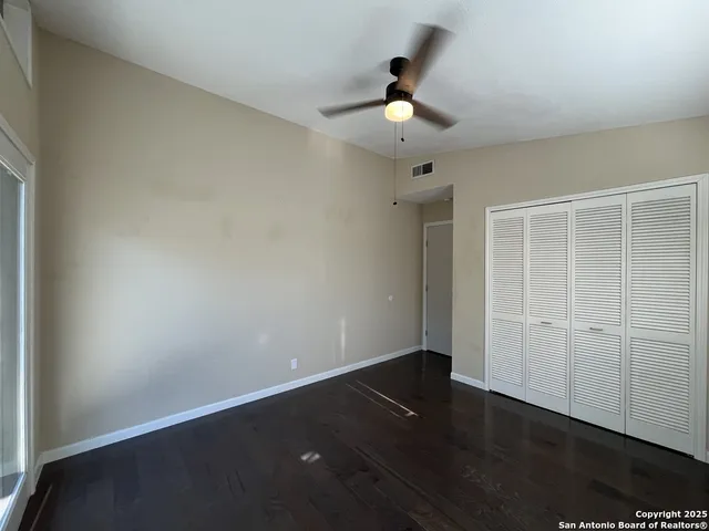 a view of a balcony with wooden floor