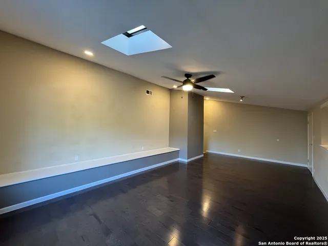 a view of yard with tree in the background