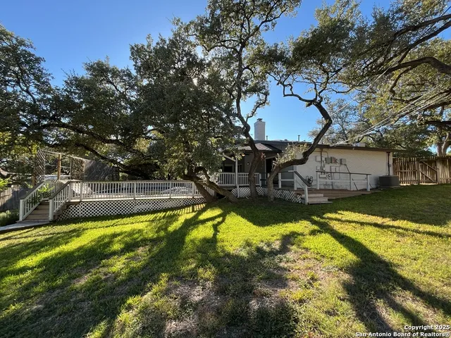 a picture of a room with a bench and a wooden floor