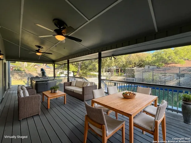 a view of a livingroom with a hardwood floor and a ceiling fan