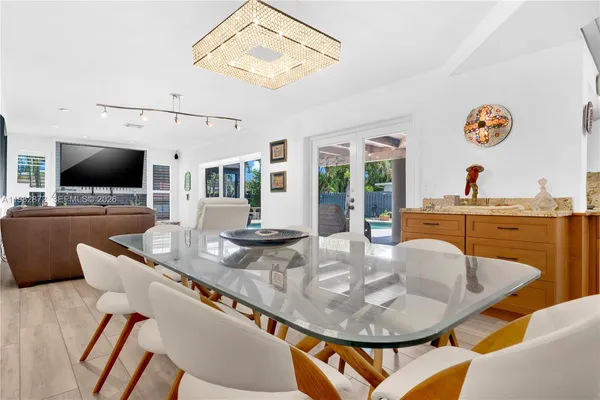 a workspace with furniture and ceiling fan