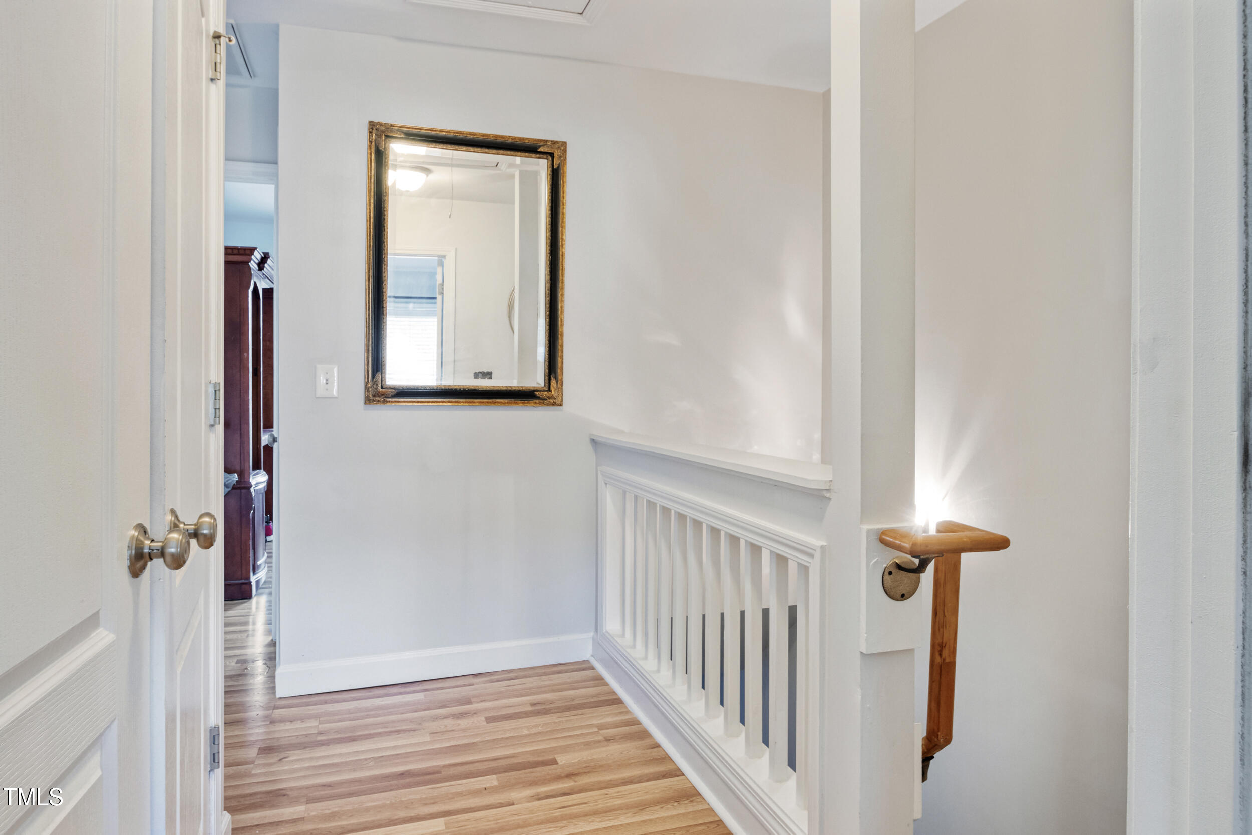 6113 Neuse Wood Drive Raleigh, NC 27616 - Photo 16 of 29 a view of a hallway with wooden floor and entryway