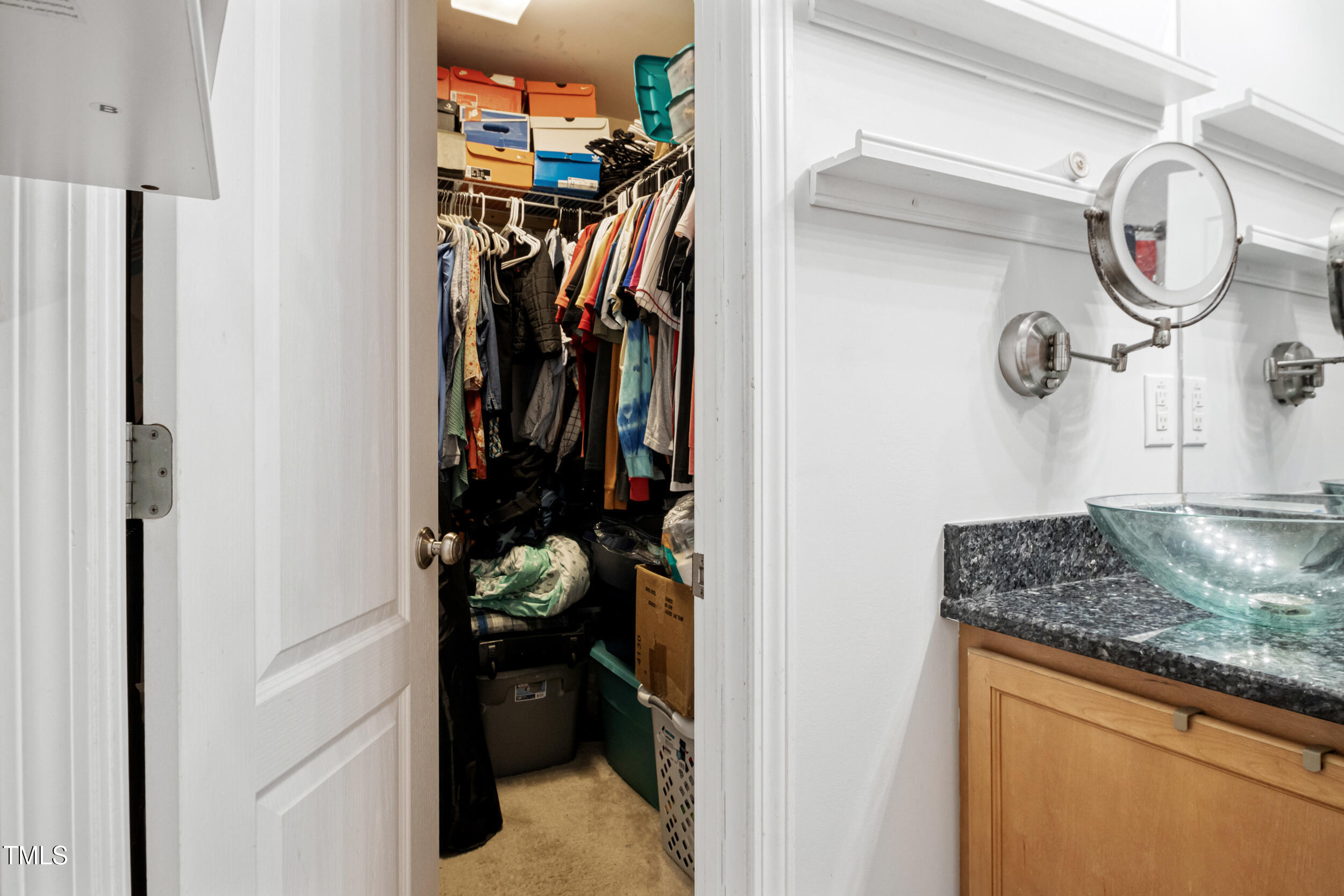 6113 Neuse Wood Drive Raleigh, NC 27616 - Photo 19 of 29 a view of walk in closet with clothes and shoes
