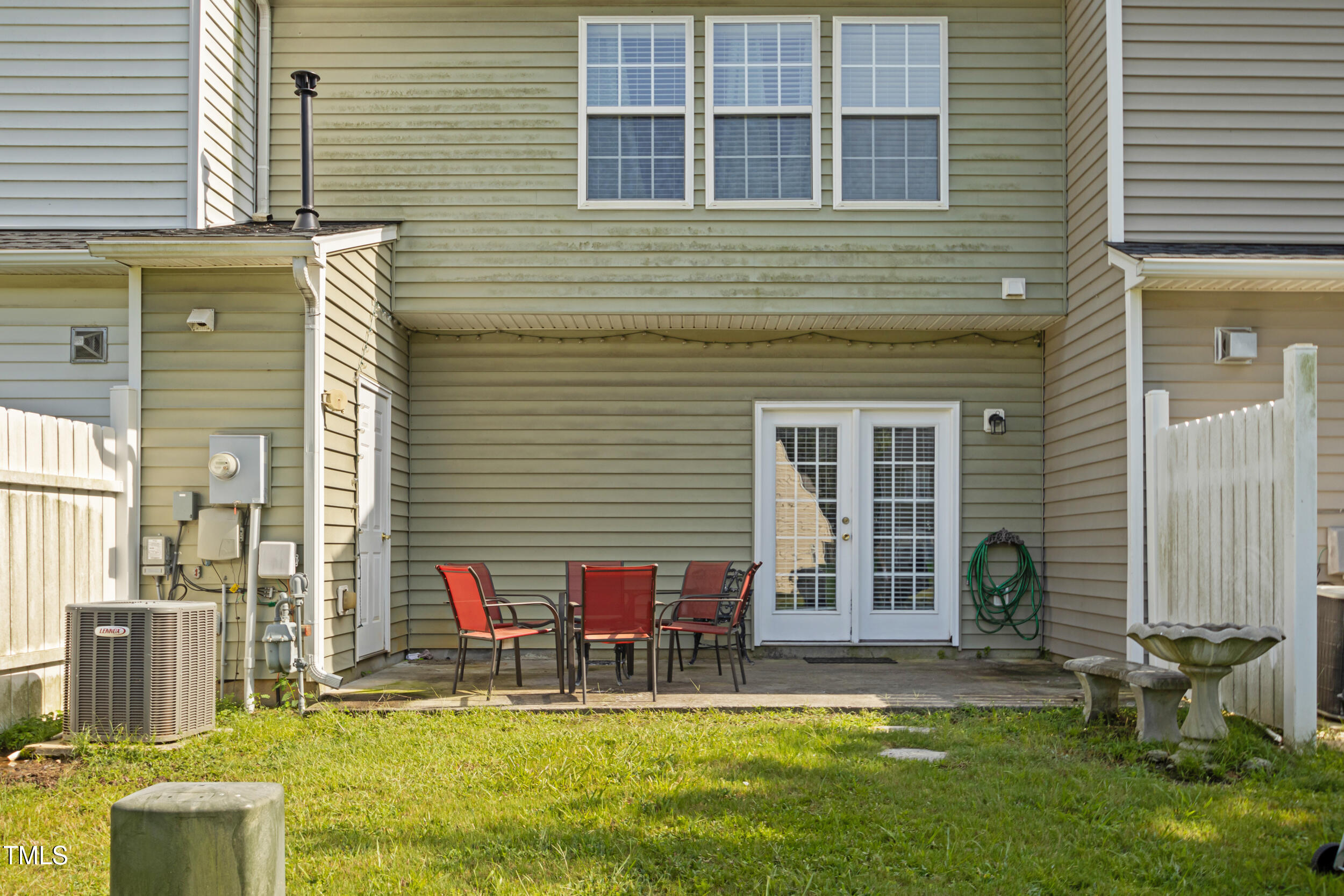 6113 Neuse Wood Drive Raleigh, NC 27616 - Photo 26 of 29 a view of a chair and table in front of house