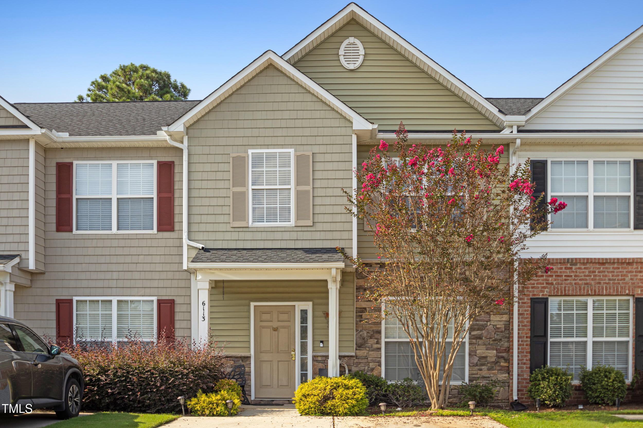 6113 Neuse Wood Drive Raleigh, NC 27616 - Photo 2 of 29 a front view of a house with plants
