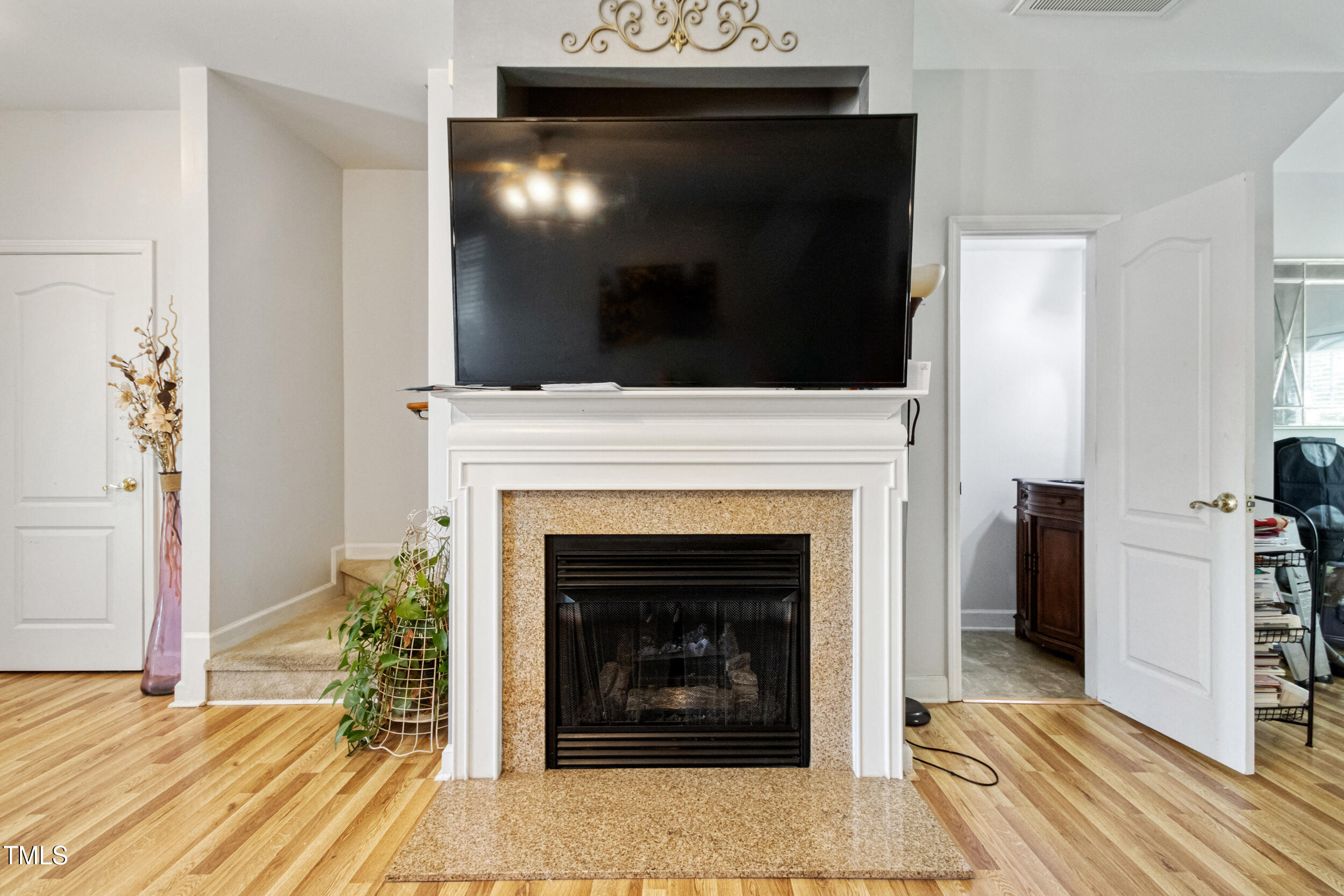 6113 Neuse Wood Drive Raleigh, NC 27616 - Photo 7 of 29 a living room with a fireplace and a fireplace