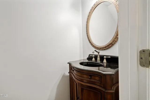 a living room with a fireplace and a fireplace