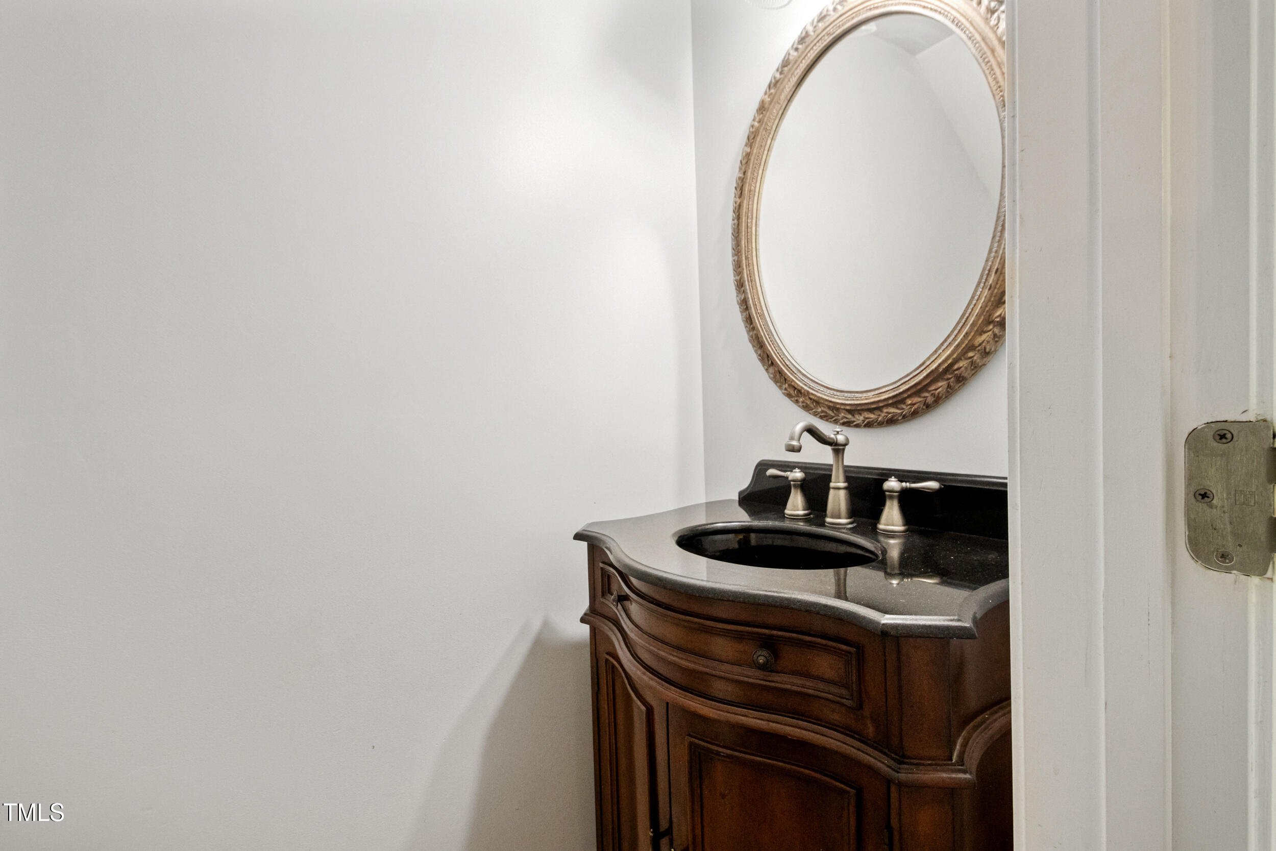 6113 Neuse Wood Drive Raleigh, NC 27616 - Photo 8 of 29 a bathroom with a sink and a mirror