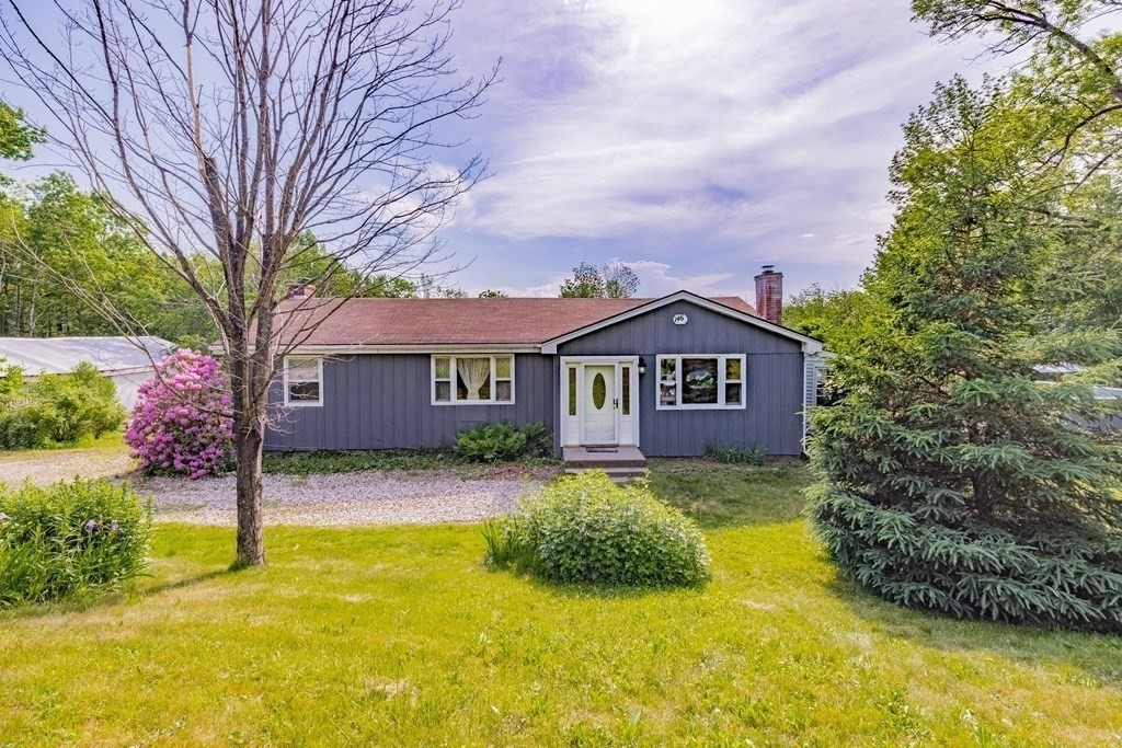 146 Bromley Road Chester, MA 01050 - Photo 1 of 40 a front view of a house with yard and green space