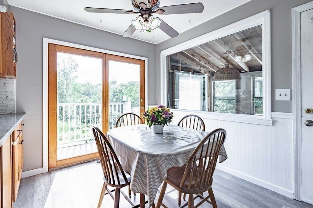 146 Bromley Road Chester, MA 01050 - Photo 11 of 40 a view of a dining room with furniture window and wooden floor