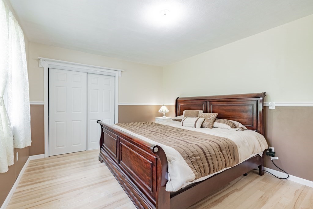 146 Bromley Road Chester, MA 01050 - Photo 14 of 40 a bedroom with a bed and a night stand