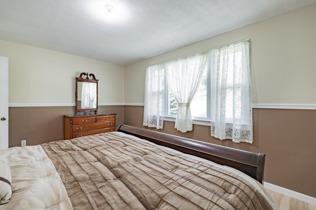 146 Bromley Road Chester, MA 01050 - Photo 15 of 40 a bedroom with a large bed and a large window