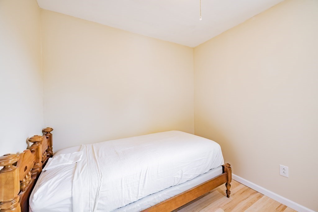 146 Bromley Road Chester, MA 01050 - Photo 20 of 40 a bed sitting in a bedroom next to a window