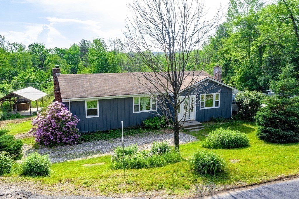 146 Bromley Road Chester, MA 01050 - Photo 2 of 40 a front view of a house with garden
