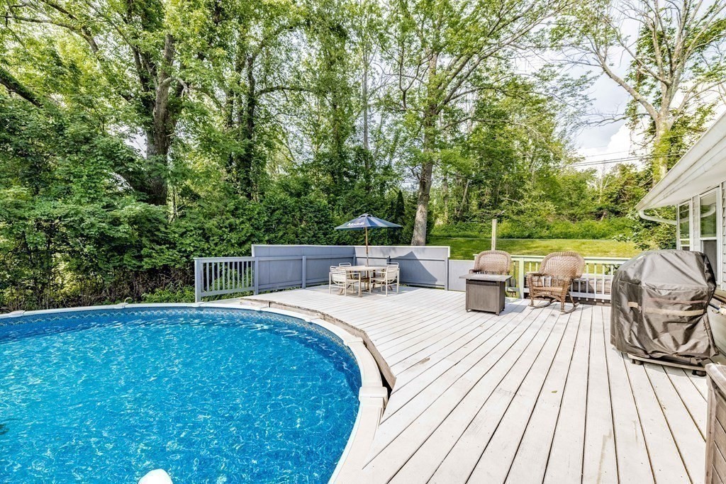 146 Bromley Road Chester, MA 01050 - Photo 32 of 40 a view of a patio with dining table and chairs with wooden floor and fence