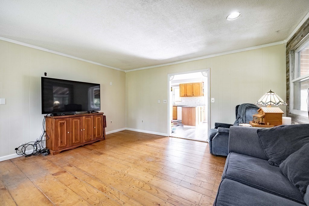 146 Bromley Road Chester, MA 01050 - Photo 6 of 40 a living room with furniture and a flat screen tv