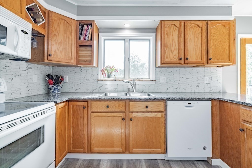 146 Bromley Road Chester, MA 01050 - Photo 9 of 40 a kitchen with stainless steel appliances granite countertop a sink stove and cabinets