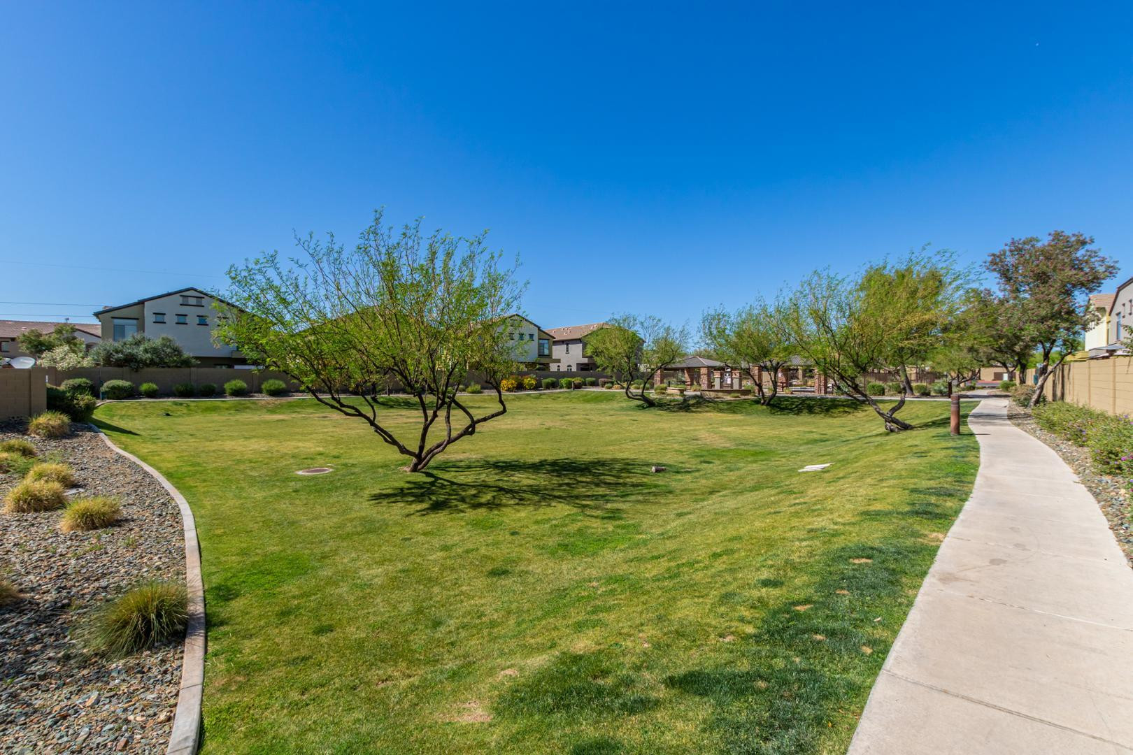 2725 East Mine Creek Road, Unit 2172 Phoenix, AZ 85024 - Photo 28 of 28 a view of a garden with a building in the background