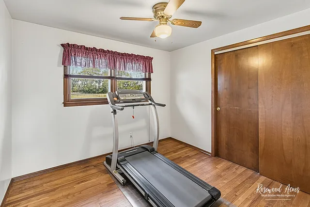 a view of a livingroom with furniture and a hallway
